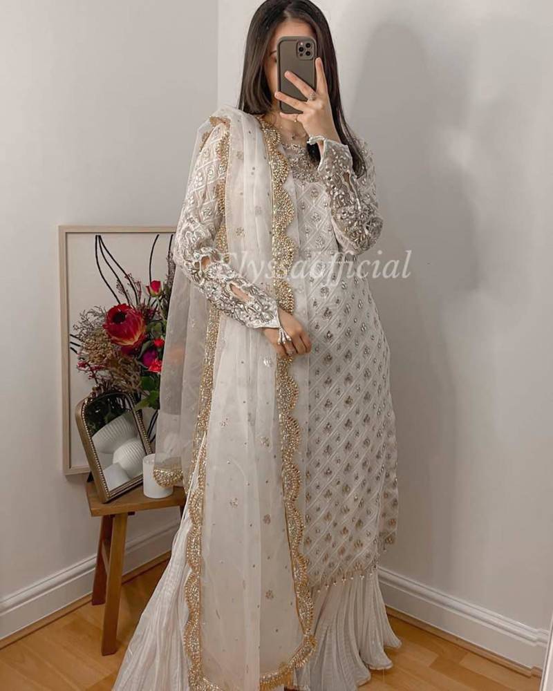 Ethereal white georgette suit with intricate silver pearl embroidery