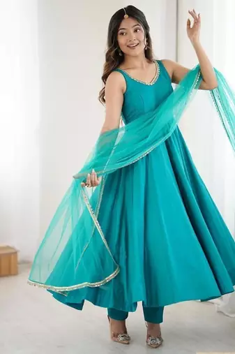 Teal blue sleeveless anarkali suit with mirror work neckline