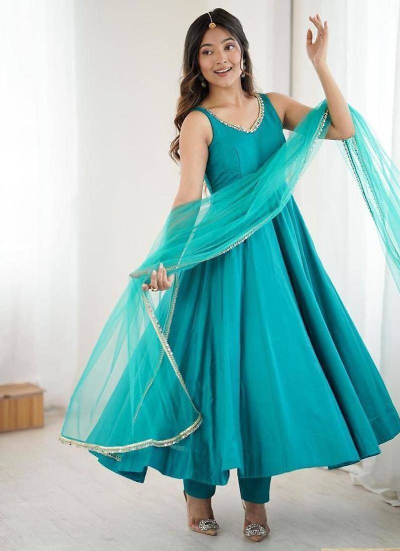 Teal blue sleeveless anarkali suit with mirror work neckline