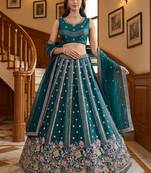 Ravishing Teal Green Embroidered Oragnza Mehendi Wear Lehenga With Blouse