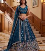 Dazzling Teal Blue Sequins Oragnza Marriage Wear Lehenga With Blouse