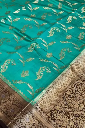 Banarasi  pure silk chiniya saree in contrast shade of teal green & black colour with floral  zari work