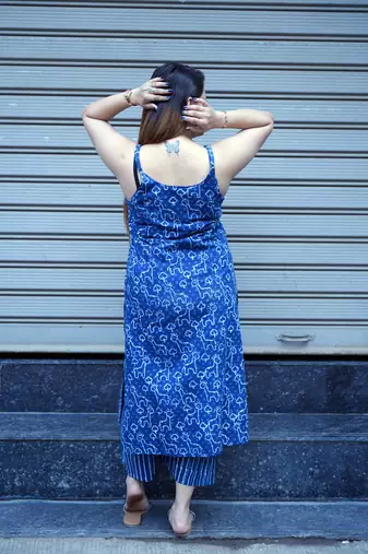 indigo printed sleeveless kurti with striped kurta set