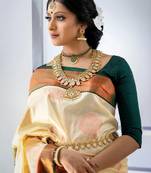 Cream green silk blend banarasi saree with unstitched blouse piece