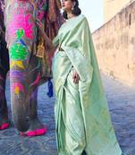 Pista green silk blend banarasi saree with unstitched blouse piece
