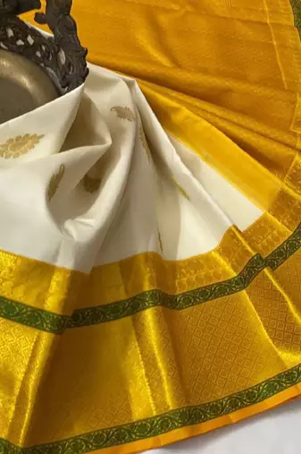 White yellow silk blend banarasi saree with unstitched blouse piece