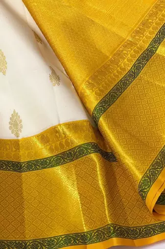 White yellow silk blend banarasi saree with unstitched blouse piece
