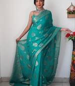 Sea green linen blend banarasi saree with unstitched blouse piece