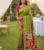 Green soft saree with zari weawing meenakari rich pallu and unique ikkat border