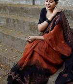 Orange black linen blend banarasi saree with unstitched blouse piece