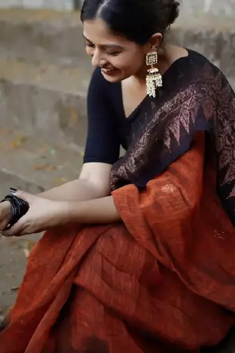Orange black linen blend banarasi saree with unstitched blouse piece