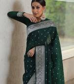 Green silk blend banarasi saree with unstitched blouse piece