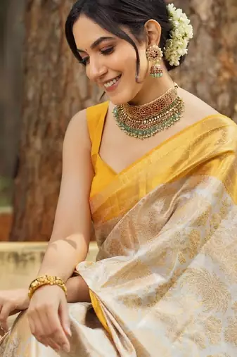 Off white silk blend banarasi saree with unstitched blouse piece