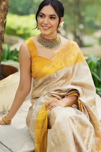 Off white silk blend banarasi saree with unstitched blouse piece