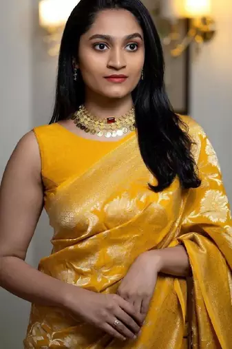 Yellow linen blend banarasi saree with unstitched blouse piece