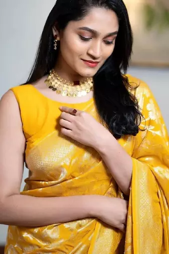 Yellow linen blend banarasi saree with unstitched blouse piece