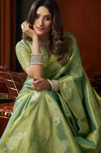  tissue saree with allover cow butta design & fancy tassels