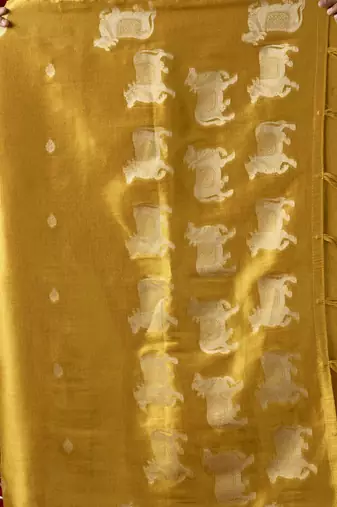  tissue saree with allover cow butta design & fancy tassels