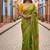 Green rangoli silk embroidery work party wear designer saree