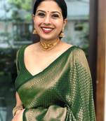 Green silk blend banarasi saree with unstitched blouse piece