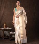 gold handloom banarasi silk saree with rich zari detailing