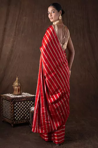 red handloom silk saree with striped zari pattern