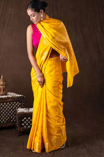 bright yellow handloom pure silk saree with woven motifs