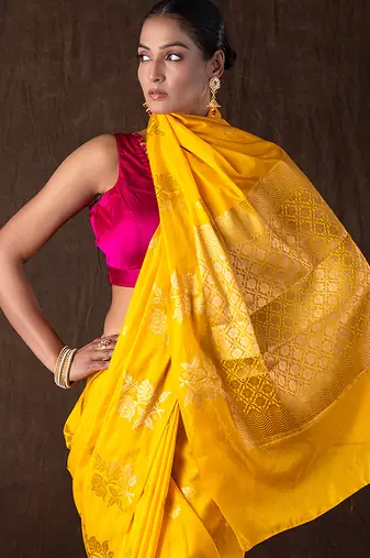 bright yellow handloom pure silk saree with woven motifs