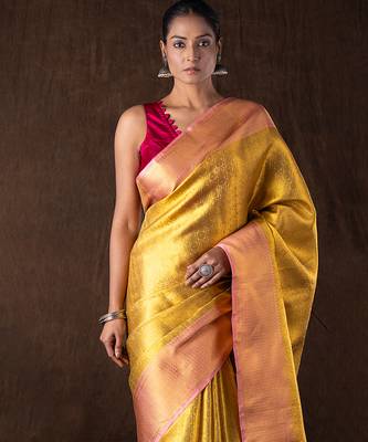 golden handloom banarasi silk saree with textured zari weave 1