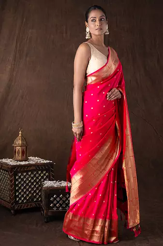 bright pink handloom tissue silk saree with zari detailing