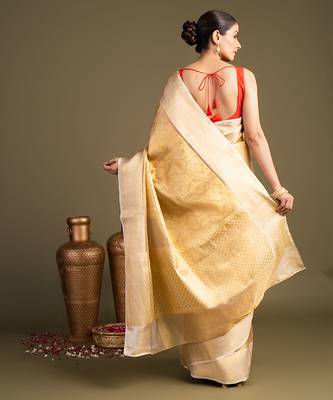 golden handloom banarasi silk saree with classic woven border 2