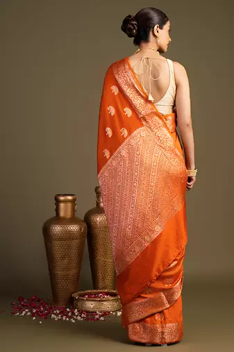 orange handloom banarasi silk saree with rich zari work