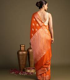 orange handloom banarasi silk saree with rich zari work