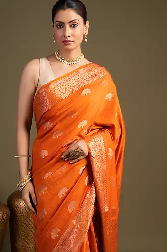 orange handloom banarasi silk saree with rich zari work