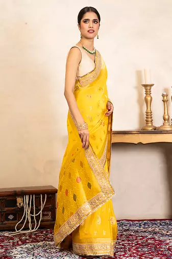yellow handloom banarasi silk saree with zari border