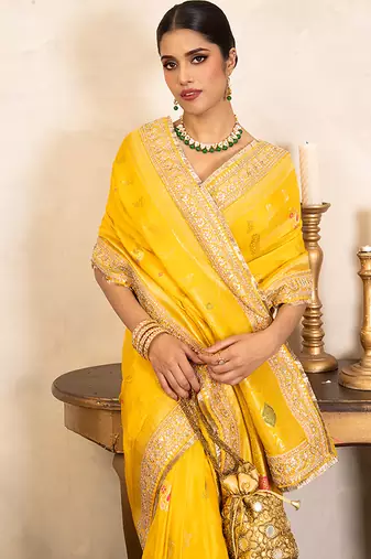 yellow handloom banarasi silk saree with zari border
