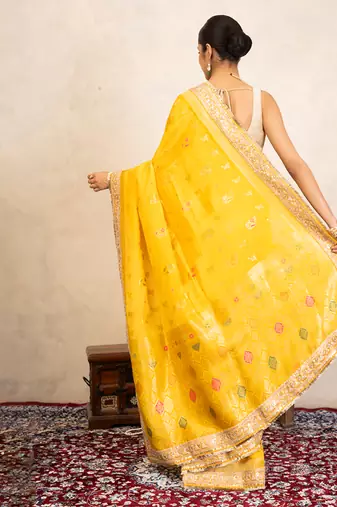 yellow handloom banarasi silk saree with zari border