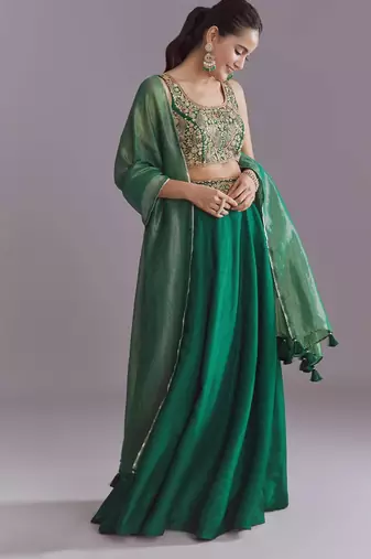 GREEN EMBROIDERY WORK FLARED LEHENGA CHOLI WITH DUPATTA.