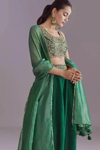 GREEN EMBROIDERY WORK FLARED LEHENGA CHOLI WITH DUPATTA.