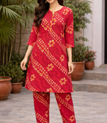 Red bandhej kurta with pant
peal embelishment on sleeves & body
