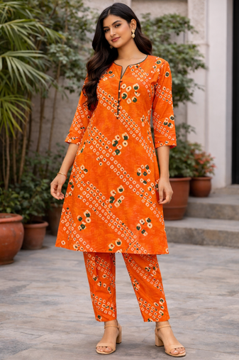 Orange bandhej kurta with pant
peal embelishment on sleeves & body