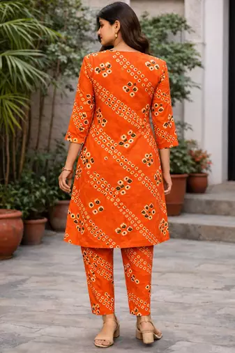 Orange bandhej kurta with pantpeal embelishment on sleeves & body