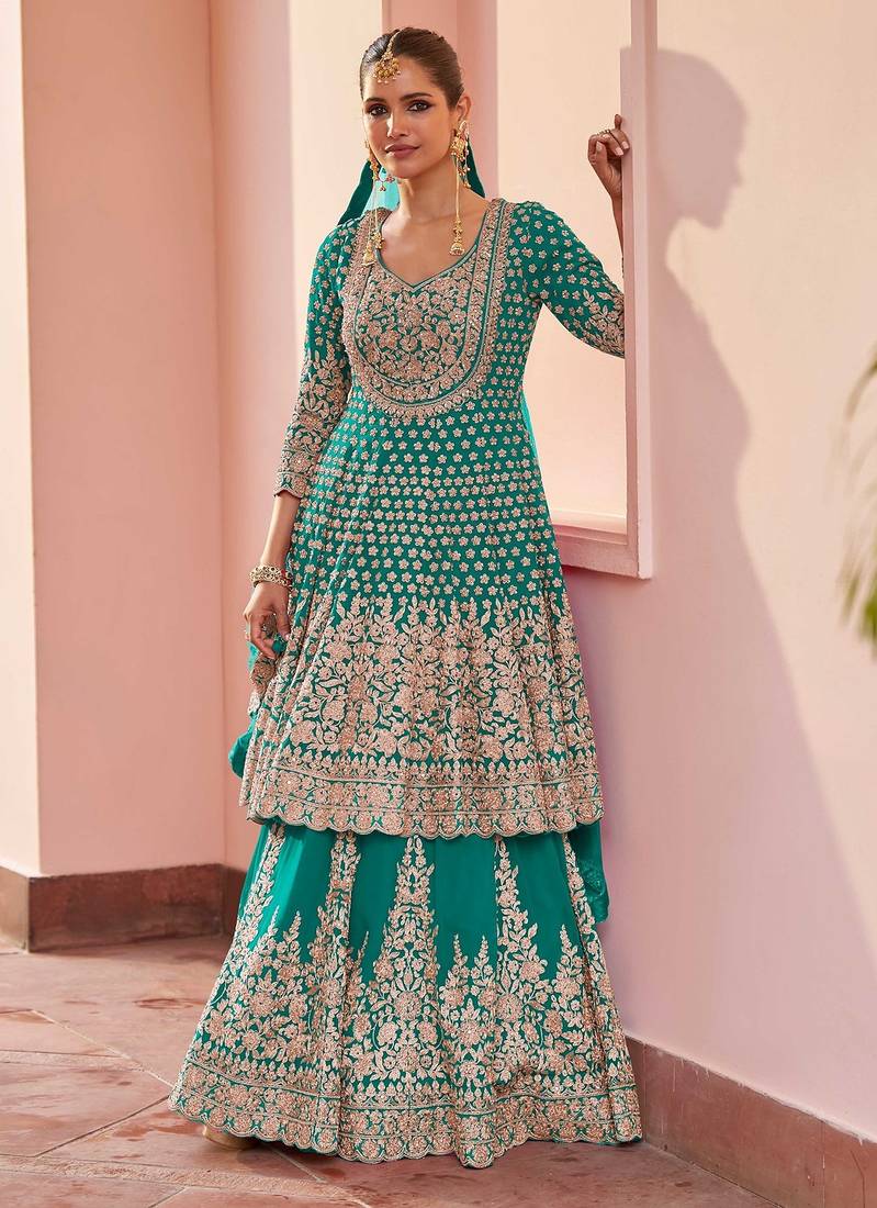 Turquoise georgette sequins work salwar suits free size up to 42