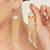 blue meenakari gold chain tassel jhumka earrings