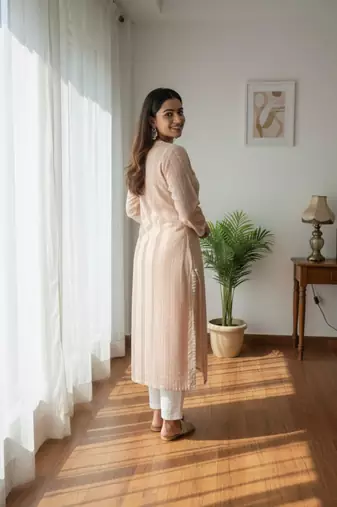 Peach chikankari kurta with intricate neckline