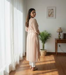 Peach chikankari kurta with intricate neckline