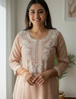 Peach chikankari kurta with intricate neckline 3