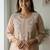 Peach chikankari kurta with intricate neckline