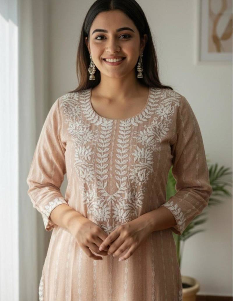 Peach chikankari kurta with intricate neckline