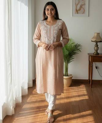 Peach chikankari kurta with intricate neckline 1